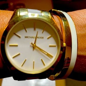 Michael Kors white and gold watch and bracelet.